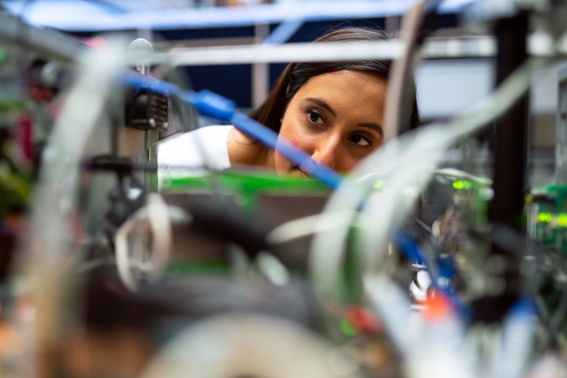 Engineer examining test equipment in a materials lab
