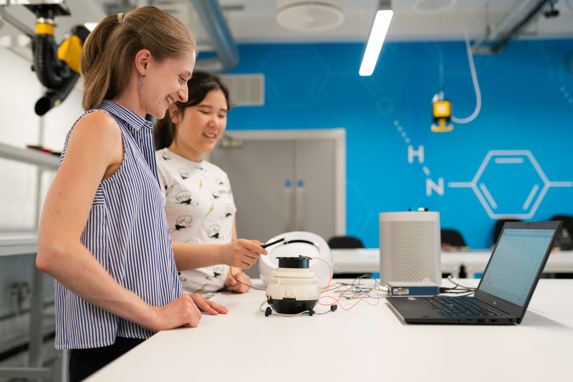 Two engineers working on research and development in a lab